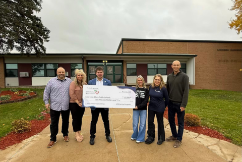 Austin presenting check